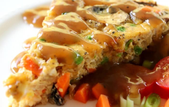 Close up of Fried Rice Frittata drizzled with brown gravy