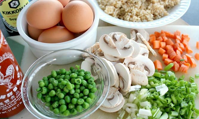 eggs, peas, mushrooms, carrots, green onions, rice, soy sauce and sriracha 