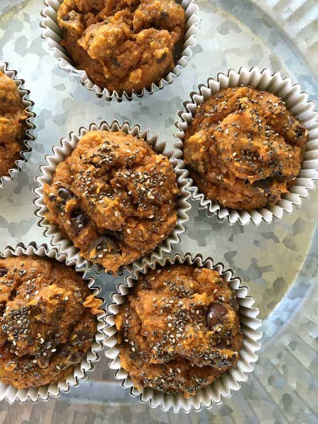 Six Healthy Pumpkin Chocolate muffins on a plate