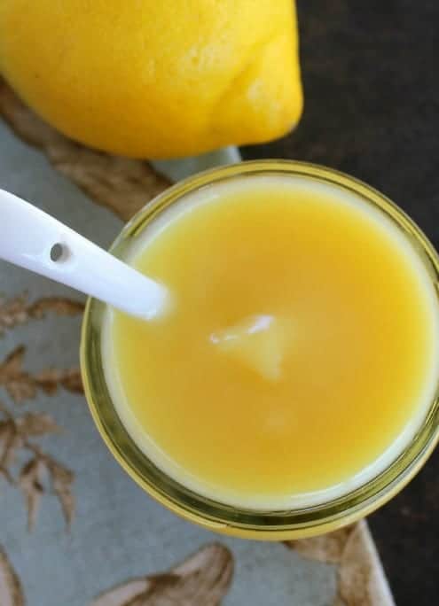 Lemon Curd in a bowl with a white spoon