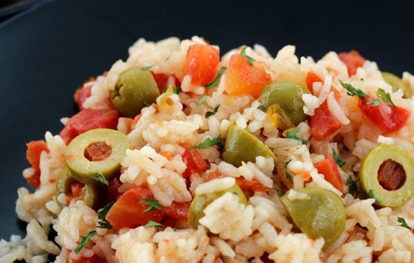 Close up of Mexican Rice with green olives and tomatoes 