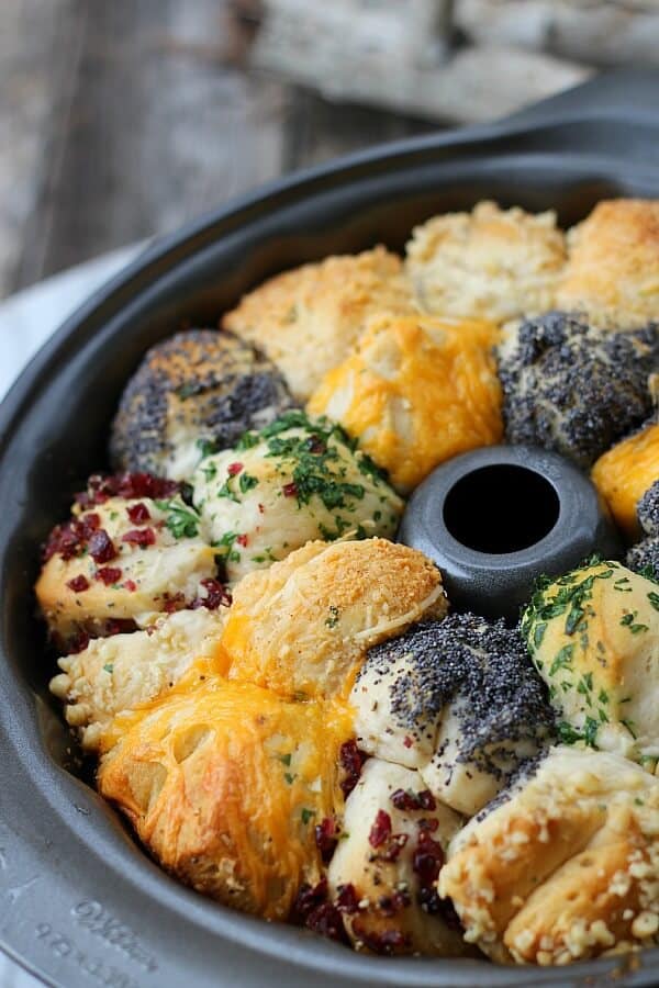 Incredible Savory Monkey Bread with all the different toppings in a bunt pan