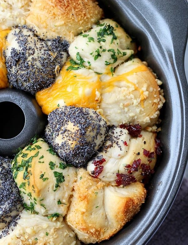 Incredible Savory Monkey Bread is buttery and flavorful, using refrigerated canister biscuits and any herb and cheese combination that fits your menu. 