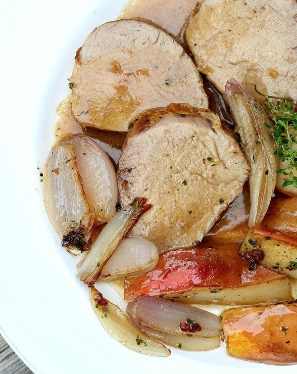 close up of sliced pork, pears, onions