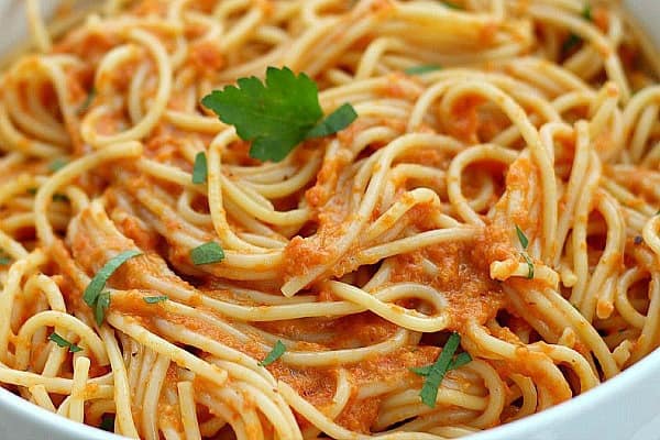 Red Pepper Pasta and Vegetable Sauce in a white bowl