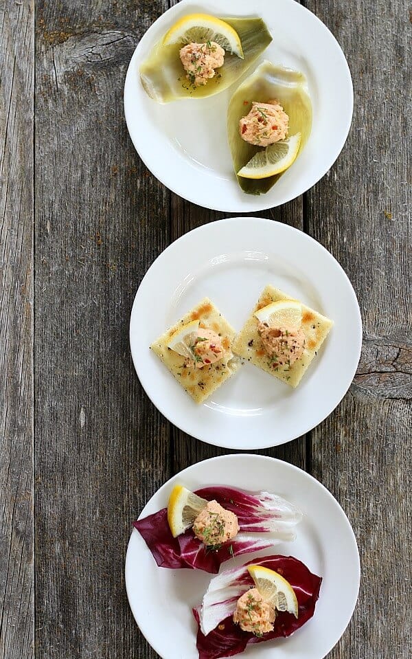 Salmon Pate' on artichokes, crackers and lettuce served on white plates