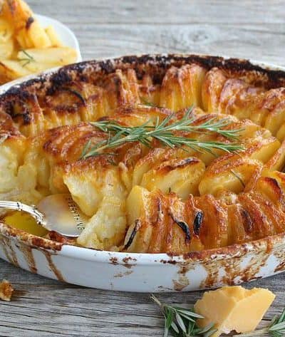 Scalloped potatoes, served Hasselback style are creamy and delicious. Cheddar and Pepper Jack with garlic and rosemary, perfectly soft yet crispy.
