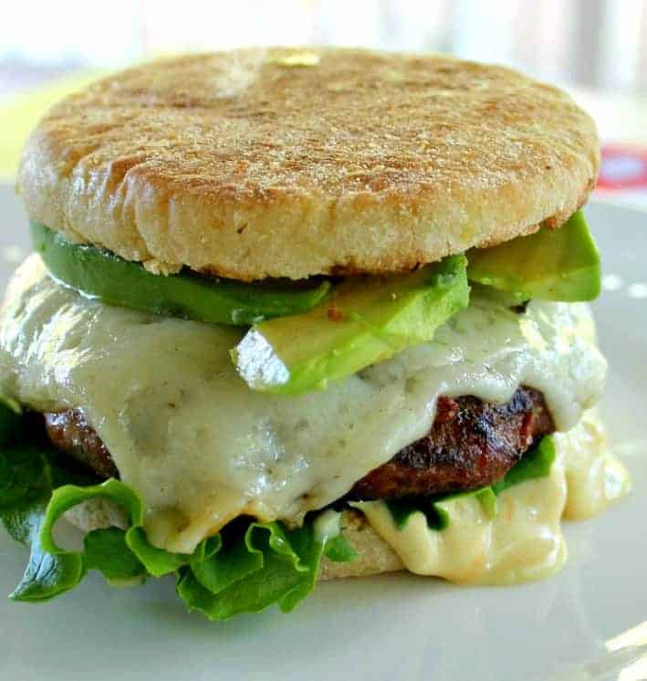 Moist and Delicious Turkey Burgers with cheese, lettuce and avocado 