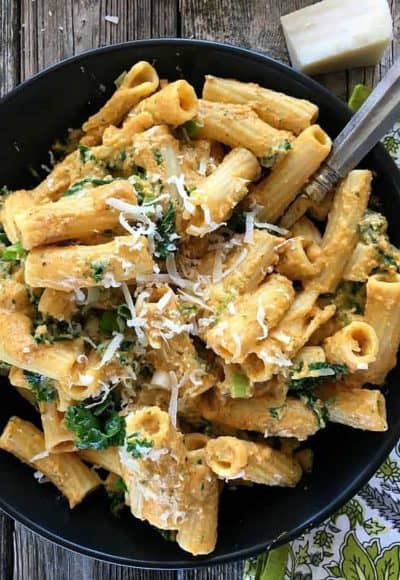 Pumpkin in this alfredo sauce replaces heavy cream with milk and reduces butter in the recipe. Healthy and tasty with Parmesan, cayenne, nutmeg and kale.