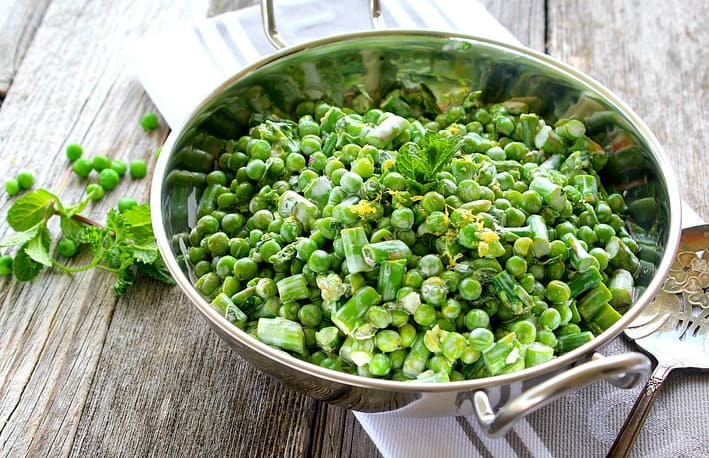 Spring Salad with Peas and Asparagus in silver serving bowl