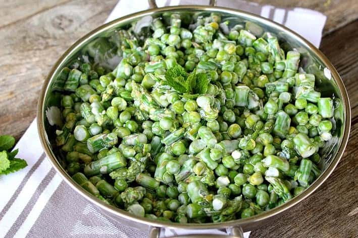 Spring Salad with Peas and Asparagus in silver serving bowl