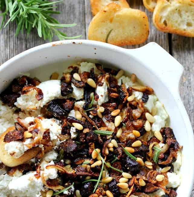 Baked Goat Cheese with caramelized onions, garlic and dried figs is an amazing appetizer with crostini or pears, and doubles as a fabulous topping for meat.