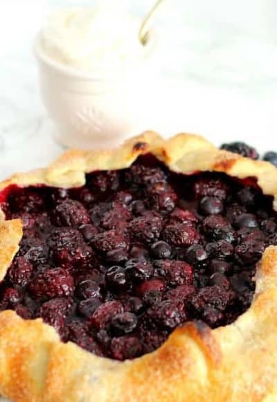 Berry galette is so easy you may never make a traditional pie again. Foolproof, flaky pie crust, use whatever berries you can find. Quick and delicious.