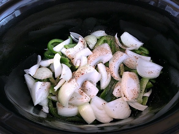 chopped onions and peppers in slow cooker