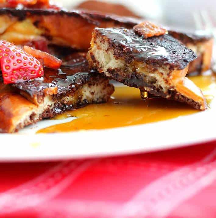 Chocolate French Toast on a white plate with syrup