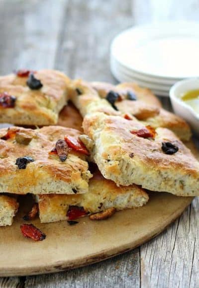 This recipe for Focaccia Bread with Olives and Rosemary is foolproof, delicious, and a great bread for beginners.
