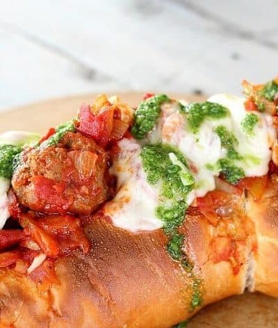 The Best Meatball Sandwich features delicious meatball sauce, serve on French bread with homemade basil paste and melted mozzarella cheese. Amazing!