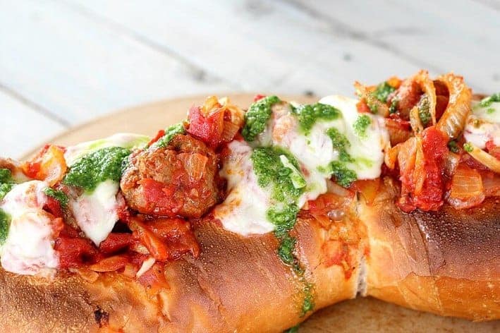 The Best Meatball Sandwich features delicious meatball sauce, serve on French bread with homemade basil paste and melted mozzarella cheese. Amazing!