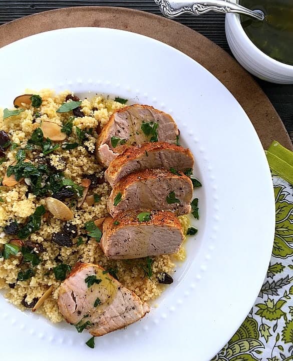 Slow cooker pork tenderloin with couscous in a white bowl