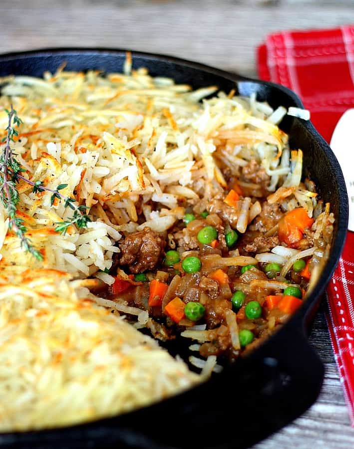 Skillet Shepherd's Pie with hashbrowns on top, beef, carrots and peas