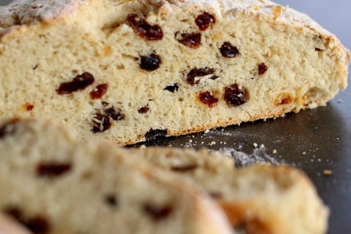 close up of irish soda bread slice with raisins