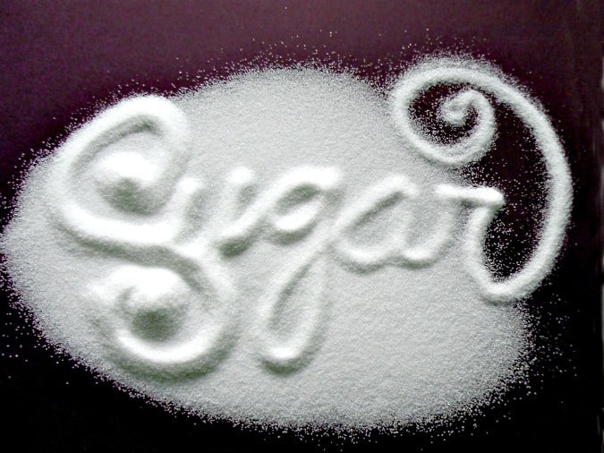 The word sugar written in sugar on the counter